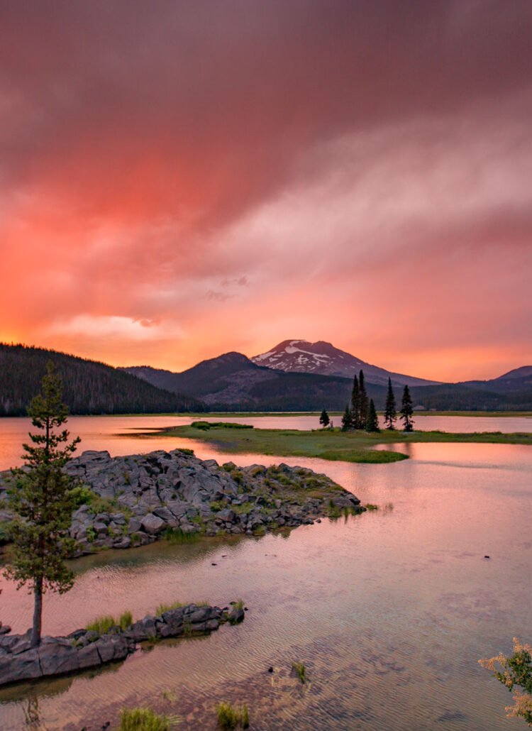 Sparks Lake near Bend at sunset with red and purple clouds over South Sister and Broken Top