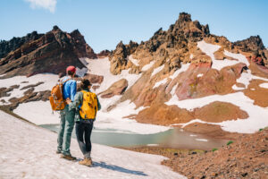 Hikers above No Name Lake on Broken Top