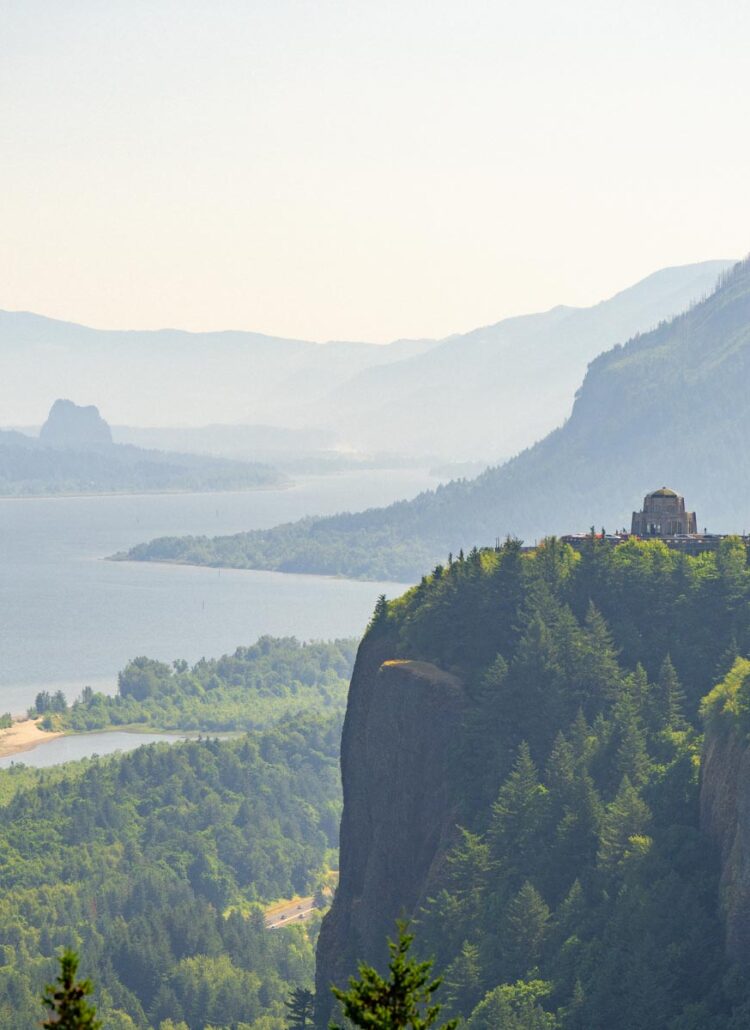 Crown Point and the historic Vista House perched on a cliff above a bend in the Columbia River Gorge