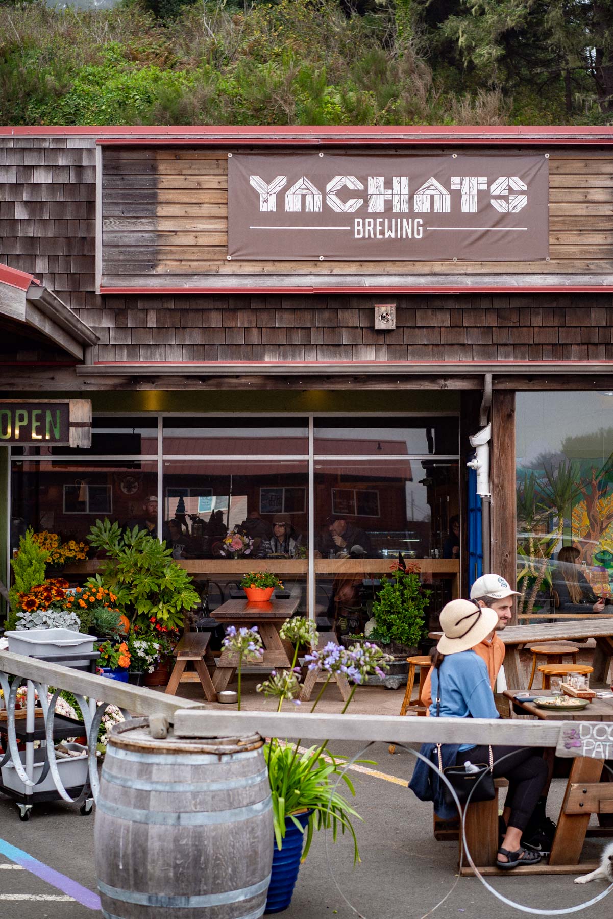 Diners at outdoor tables outside Yachats Brewing on the southern Oregon coast